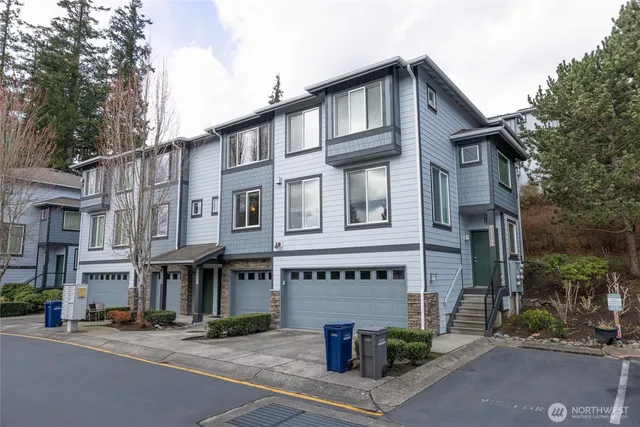 a front view of a building with parking area