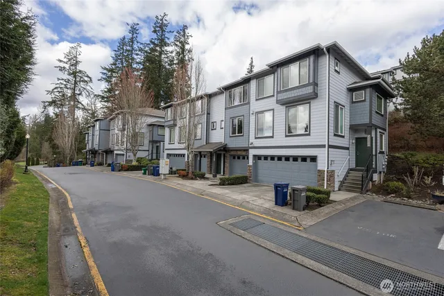 a front view of a building with trees