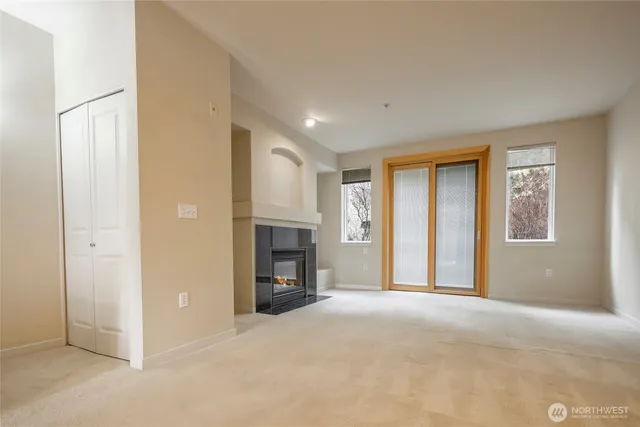 a view of livingroom with fireplace and window