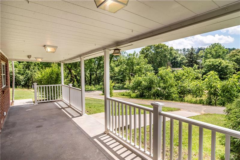 581 Arden Road Washington, PA 15301 - Photo 22 of 25 Beautiful side porch with views of trees.