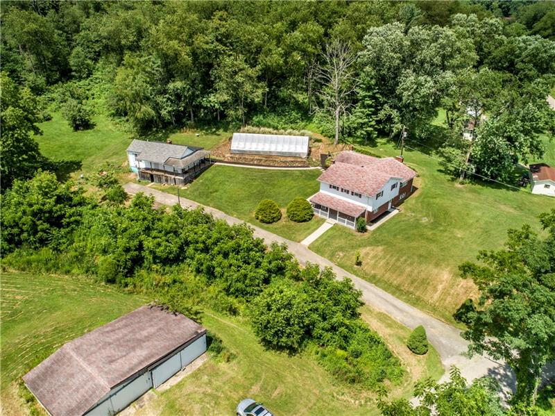 581 Arden Road Washington, PA 15301 - Photo 4 of 25 Massive garage, Main House, Guest House, Green House... If you've always wanted your own land that feels remote and private yet is still only less than 10 minutes from major roadways and amenities, this is it!