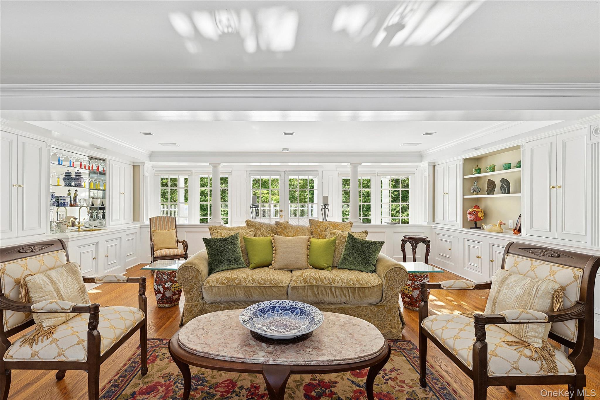 33 Bridgefield Road, Unit 2446 MAIN STREET Bridgehampton, NY 11932 - Photo 15 of 28 a living room with furniture and a large window