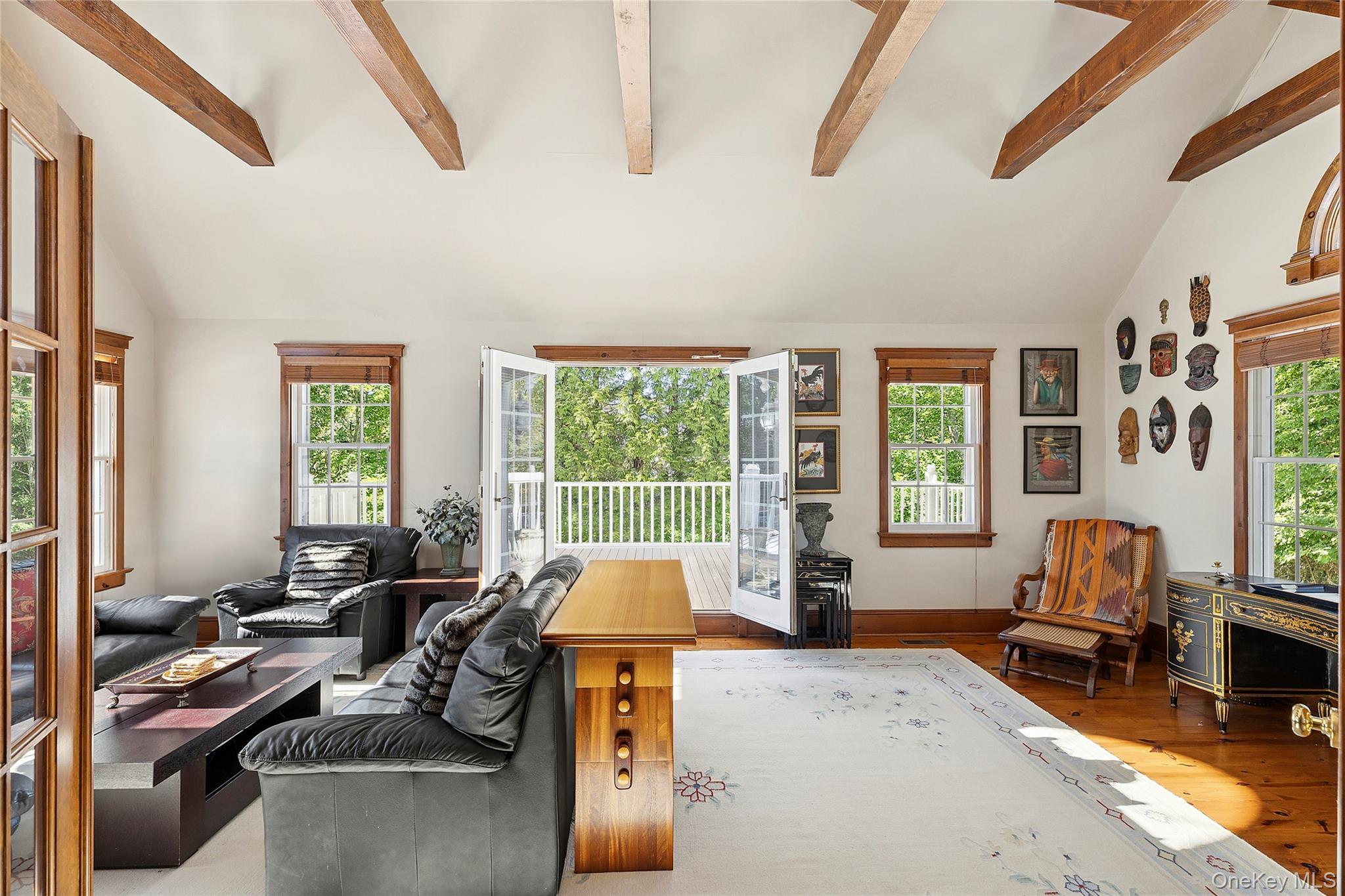 33 Bridgefield Road, Unit 2446 MAIN STREET Bridgehampton, NY 11932 - Photo 18 of 28 a living room with furniture and a large window