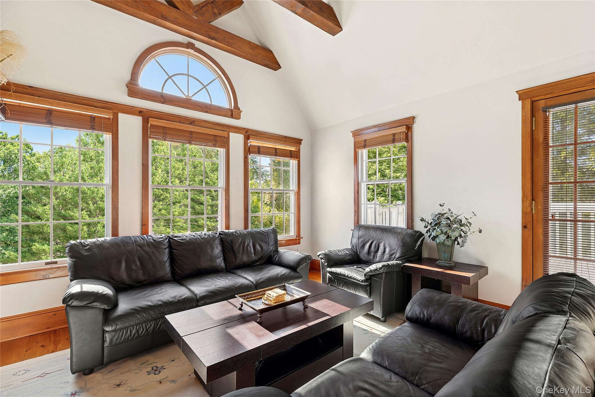 33 Bridgefield Road, Unit 2446 MAIN STREET Bridgehampton, NY 11932 - Photo 19 of 28 a living room with furniture and a large window