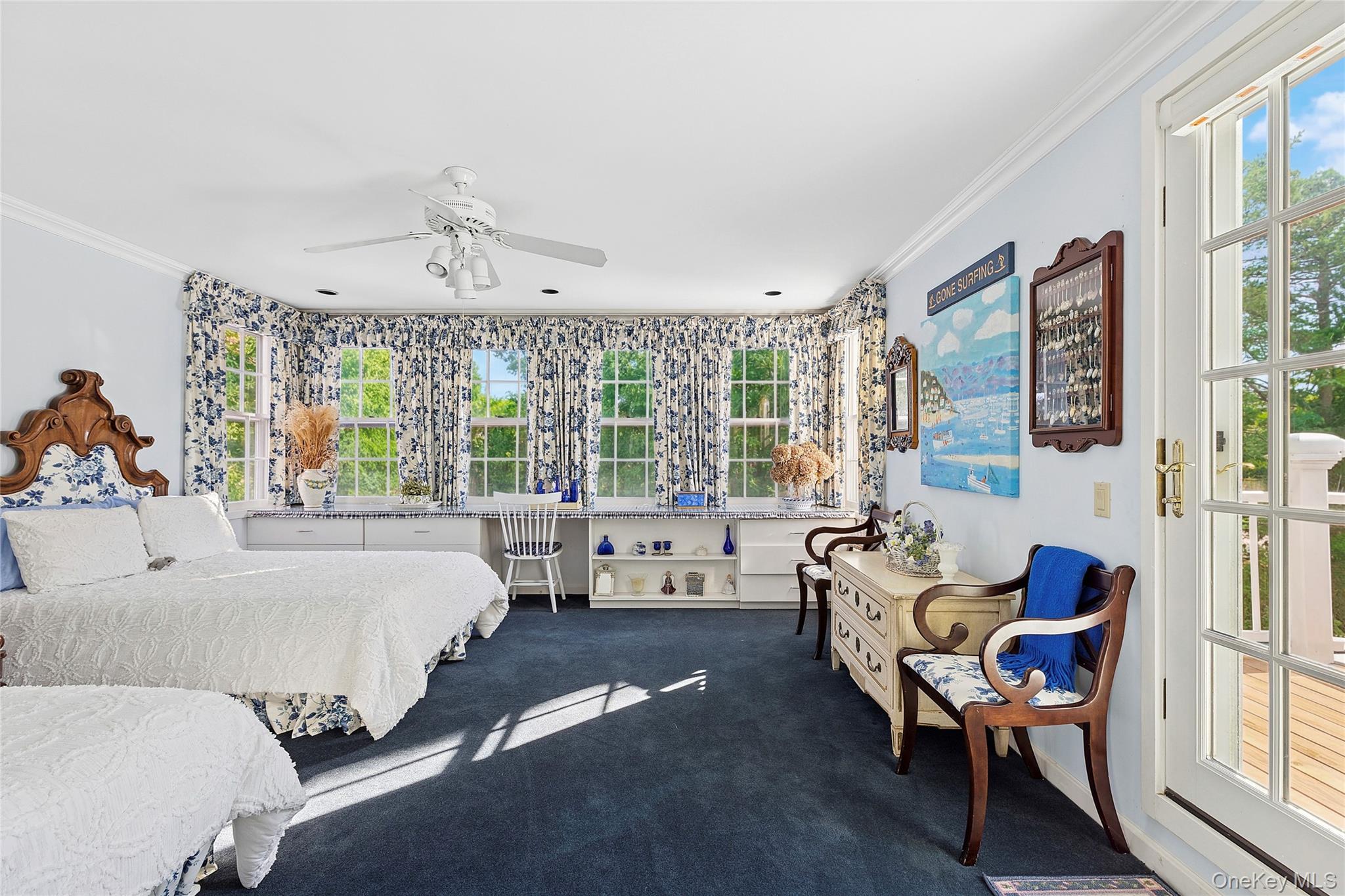 33 Bridgefield Road, Unit 2446 MAIN STREET Bridgehampton, NY 11932 - Photo 24 of 28 a living room with furniture and a large window