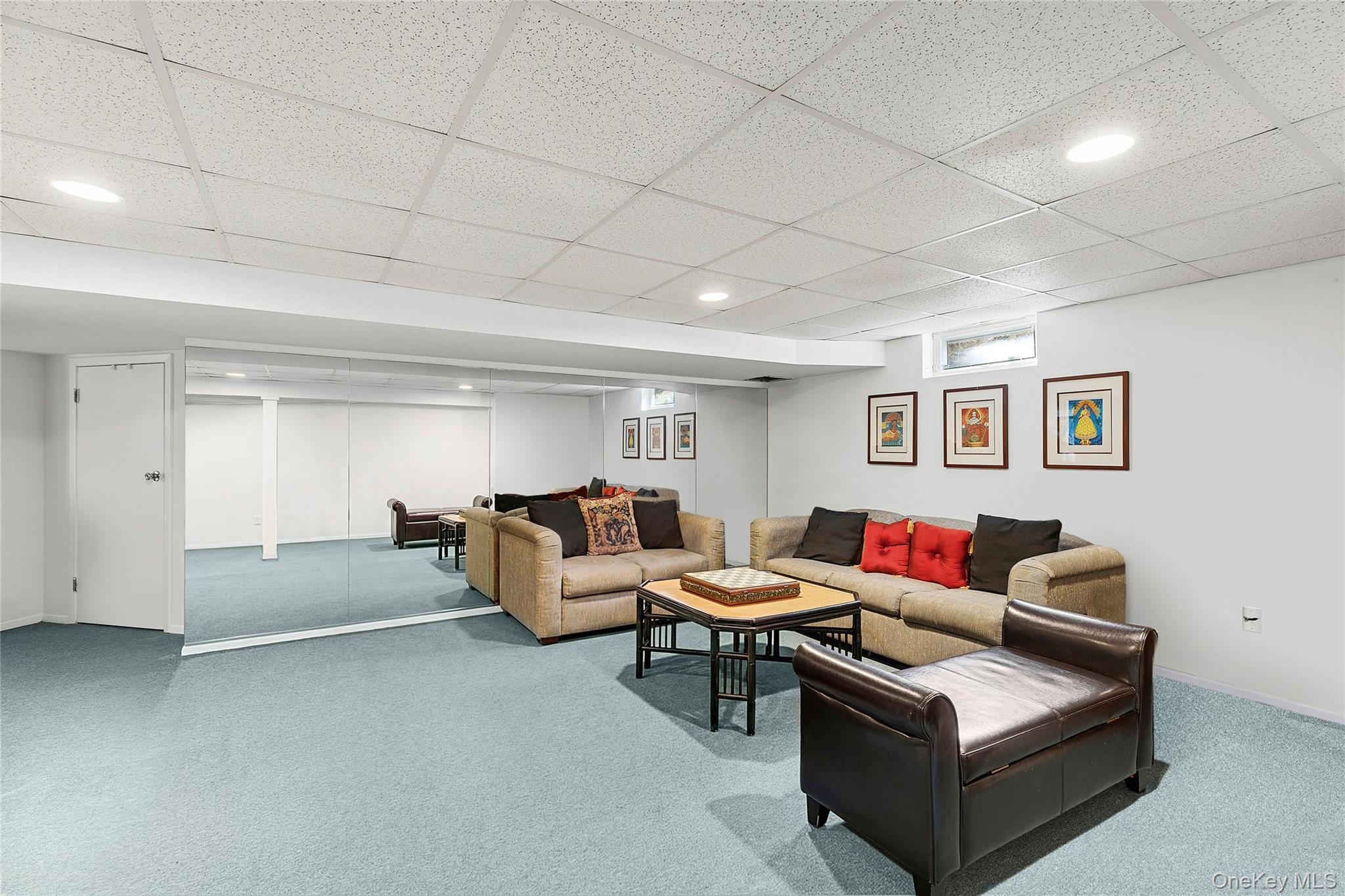 33 Bridgefield Road, Unit 2446 MAIN STREET Bridgehampton, NY 11932 - Photo 27 of 28 a living room with furniture and a window