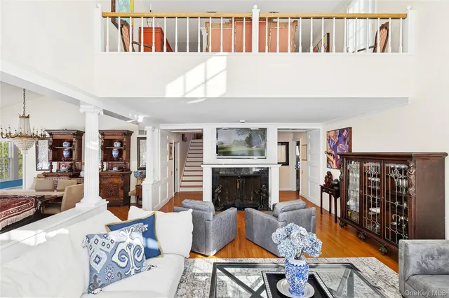 a living room with furniture fireplace and rug
