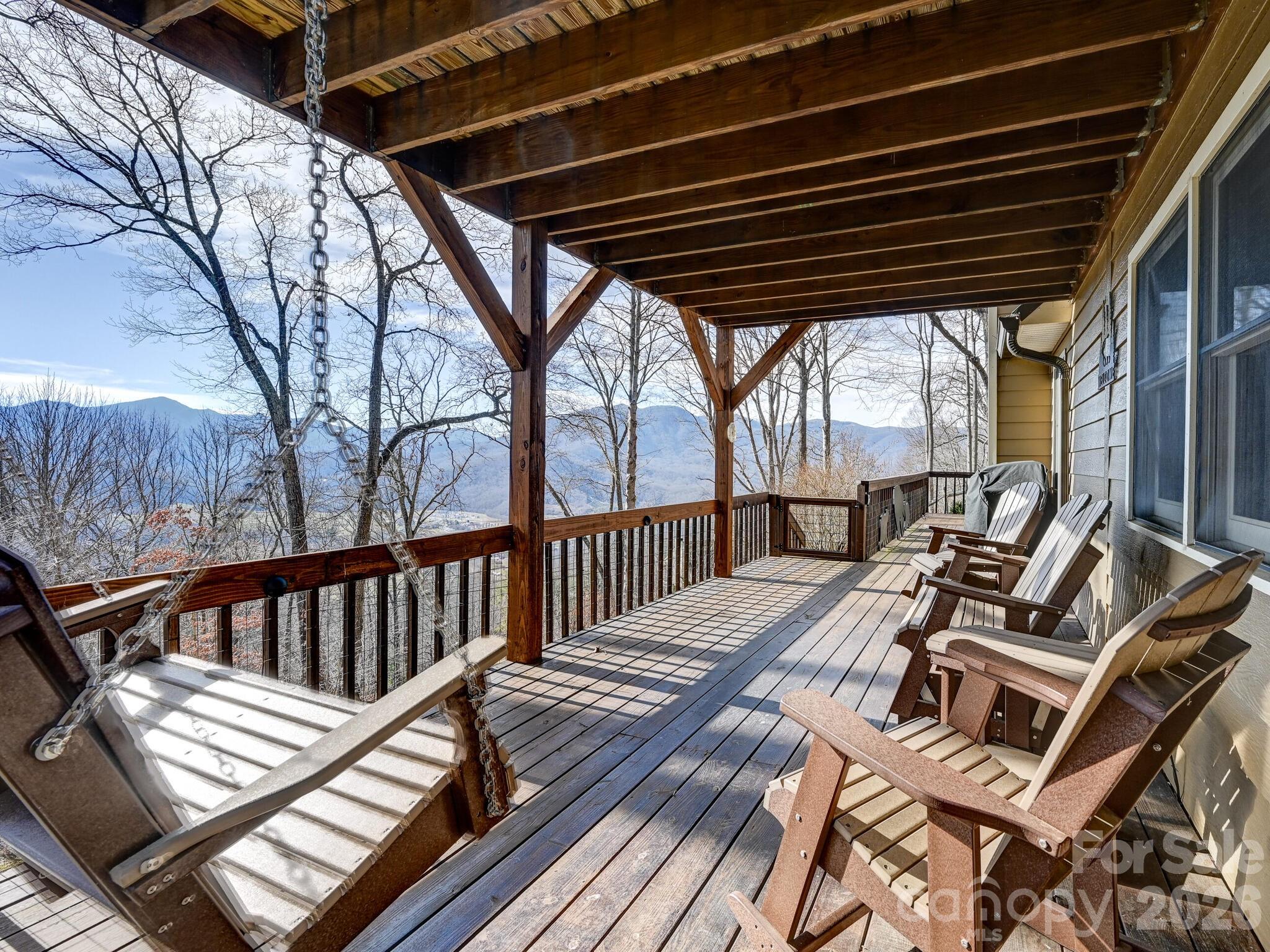 a view of balcony with wooden floor and outdoor seating