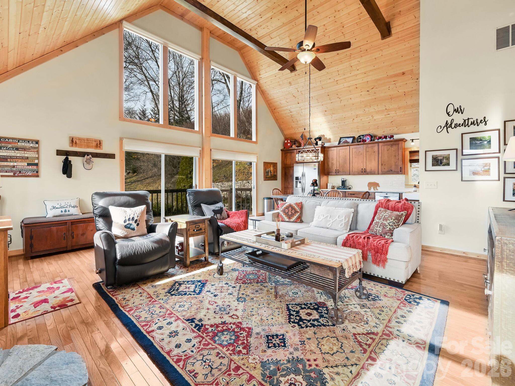 1954 Utah Mountain Road Waynesville, NC 28785 - Photo 11 of 36 a living room with furniture fireplace and a rug