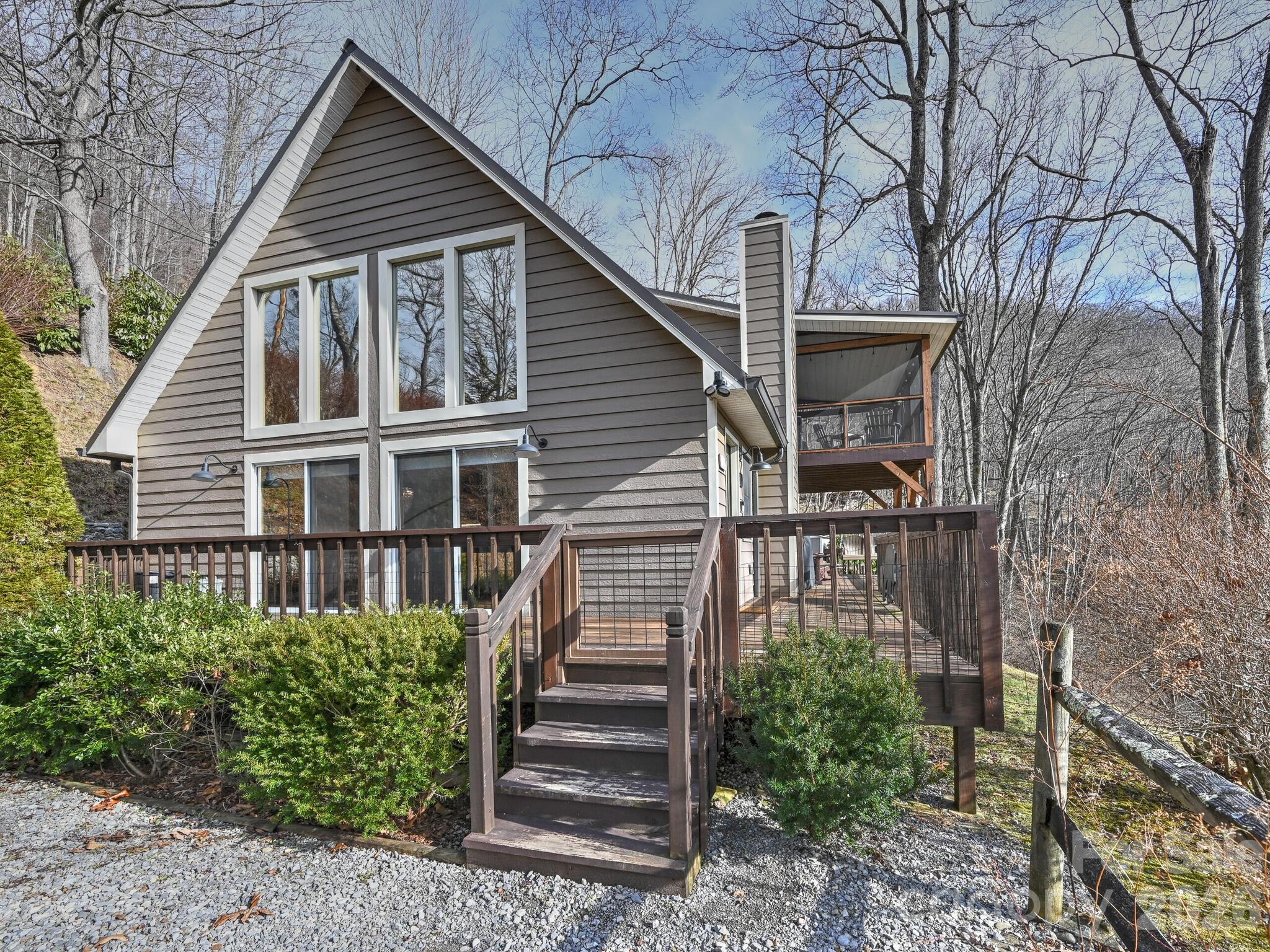 1954 Utah Mountain Road Waynesville, NC 28785 - Photo 2 of 36 a view of a house with backyard and trees