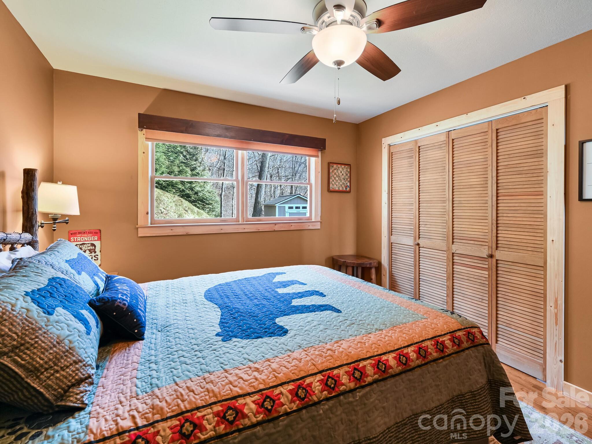 1954 Utah Mountain Road Waynesville, NC 28785 - Photo 21 of 36 a bedroom with a large bed and a window