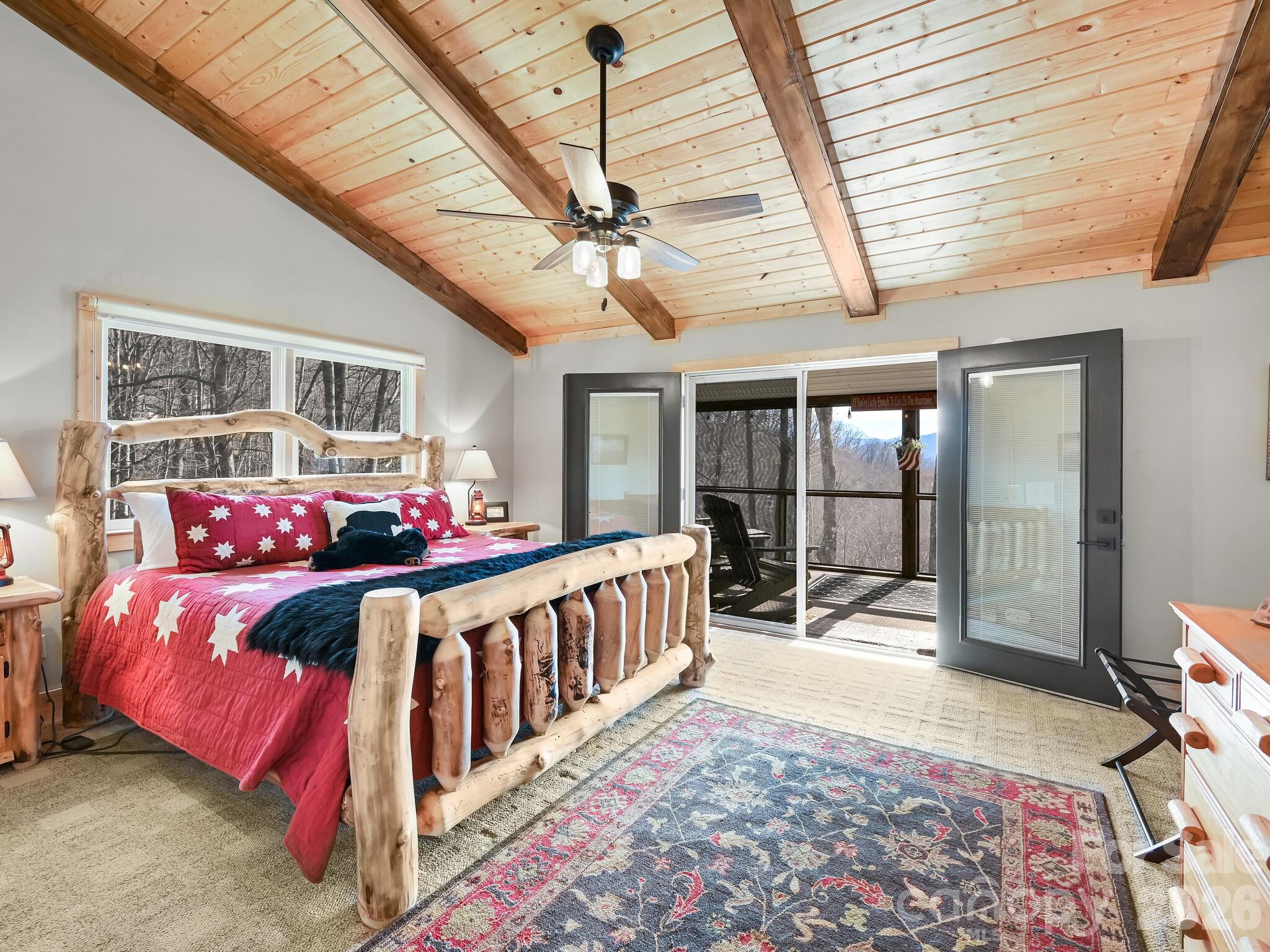 1954 Utah Mountain Road Waynesville, NC 28785 - Photo 25 of 36 a bedroom with furniture and windows