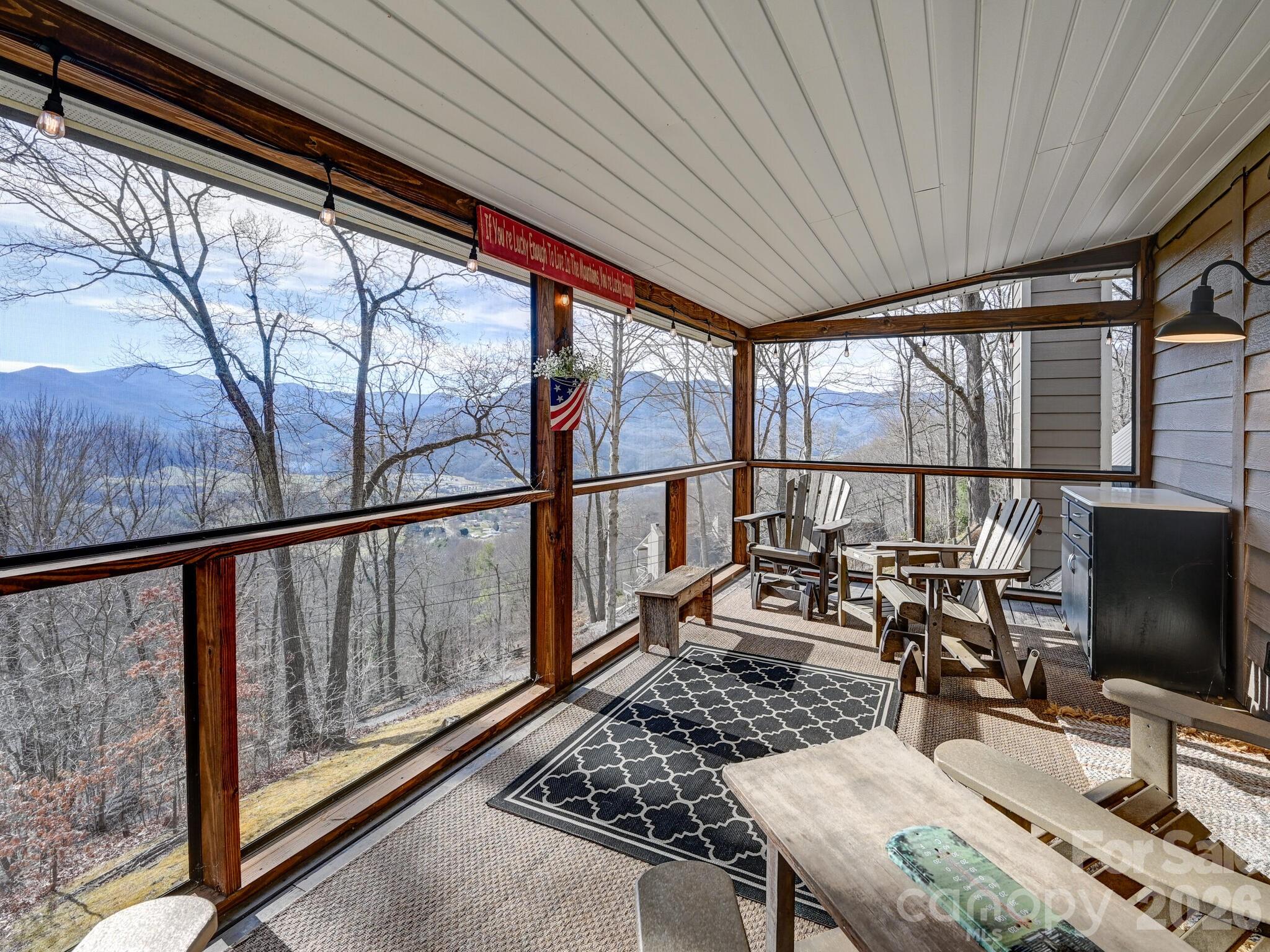 1954 Utah Mountain Road Waynesville, NC 28785 - Photo 31 of 36 a living room with large windows