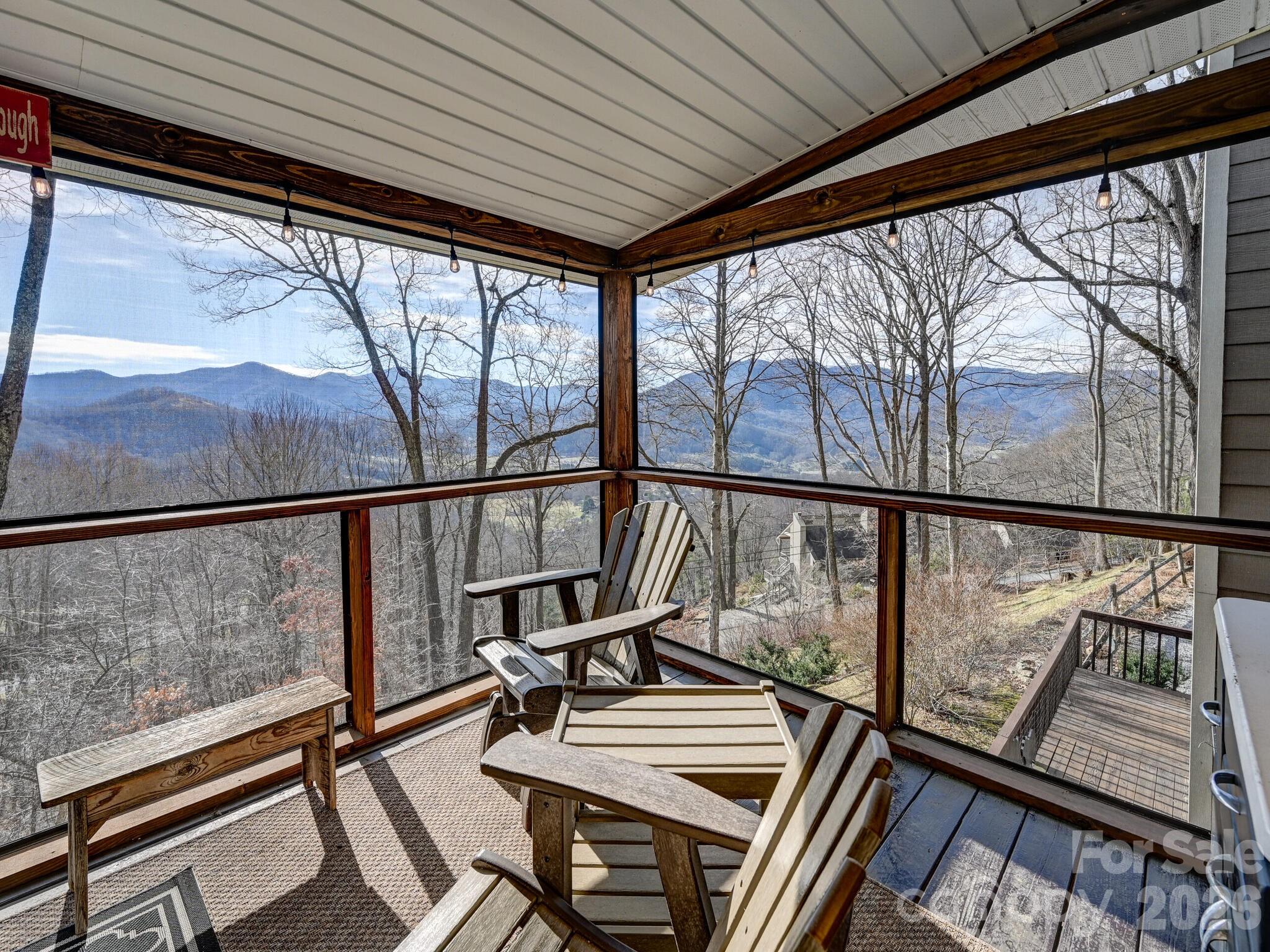 1954 Utah Mountain Road Waynesville, NC 28785 - Photo 32 of 36 a view of an empty room with wooden floor and furniture