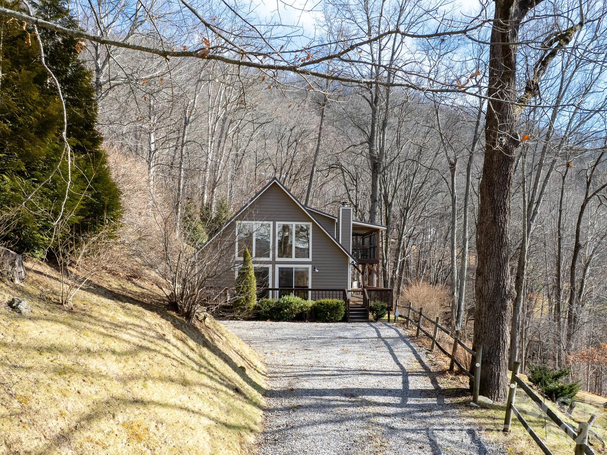1954 Utah Mountain Road Waynesville, NC 28785 - Photo 7 of 36 a front view of a house with a yard