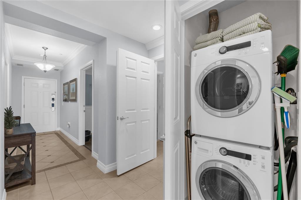 7618 Sandy Ridge Drive, Unit 103 Reunion, FL 34747 - Photo 20 of 37 a view of a hallway with washer and dryer