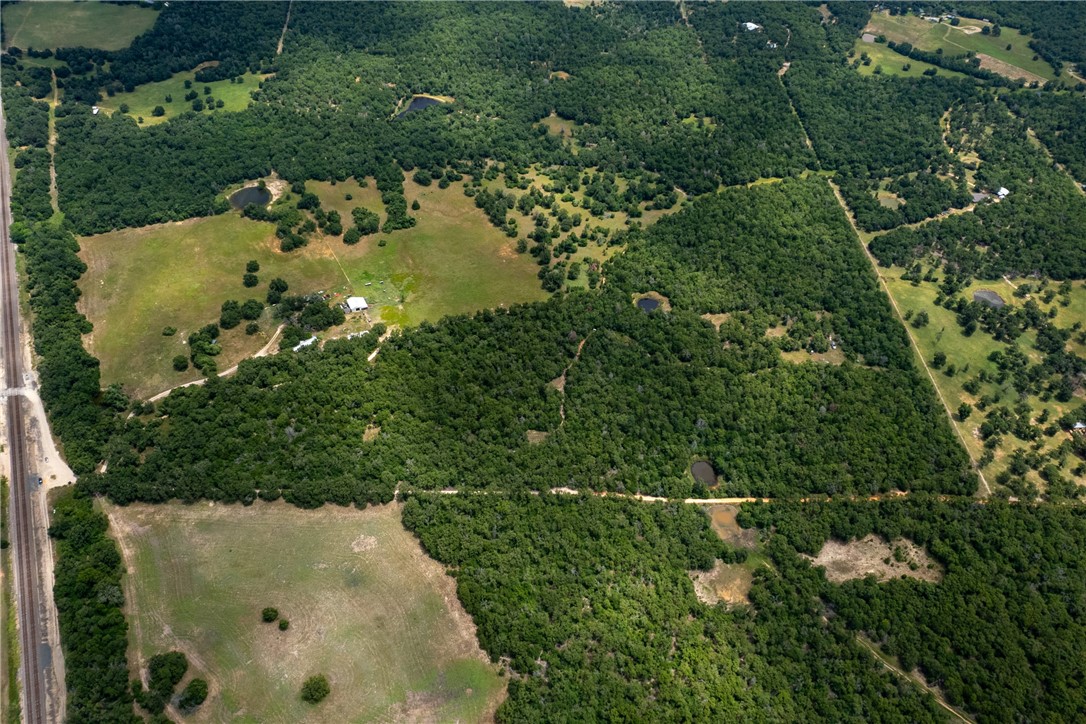 145 Private Road 6070 Cameron, TX 76520 - Photo 7 of 24 an aerial view of a houses with yard