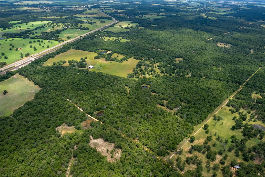 145 Private Road 6070 Cameron, TX 76520 - Photo 9 of 24 a backyard of a house with lots of green space