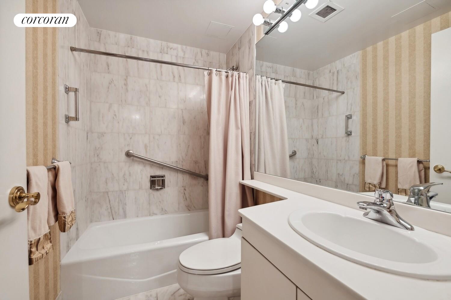 150 East 85th Street, Unit 8ABC Manhattan, NY 10028 - Photo 9 of 12 a bathroom with a sink a toilet and shower