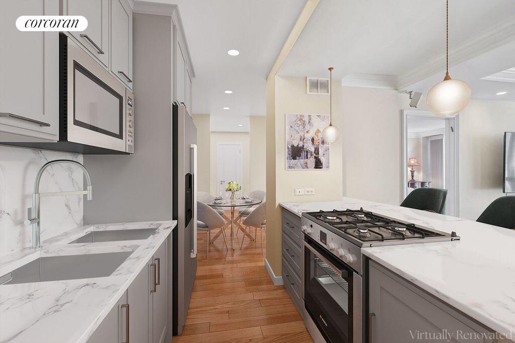 150 East 85th Street, Unit 8ABC Manhattan, NY 10028 - Photo 2 of 12 a kitchen with granite countertop a sink stove and cabinets