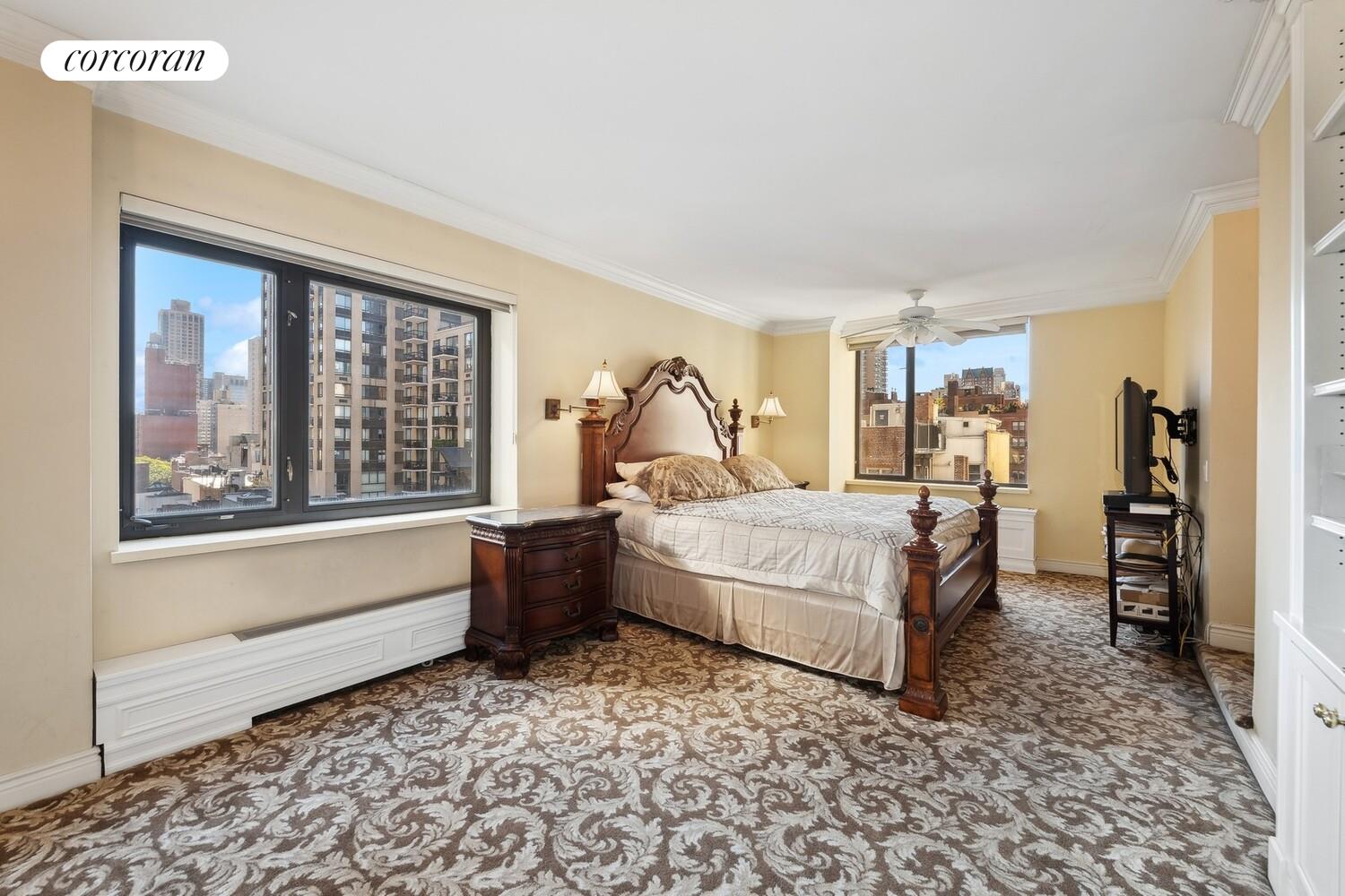 150 East 85th Street, Unit 8ABC Manhattan, NY 10028 - Photo 4 of 12 a bedroom with a large bed and a window