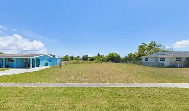 a view of a house with a big yard