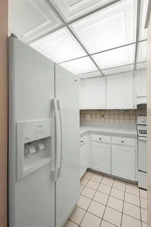 a kitchen with a sink and a refrigerator