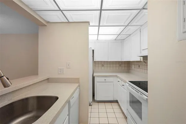 a kitchen with a sink and cabinets