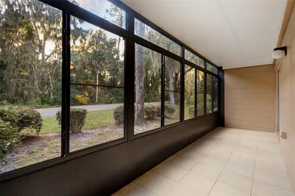 a view of an empty room with windows