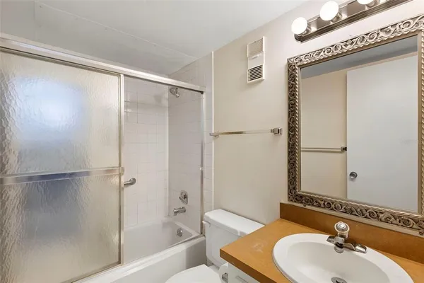 a view of a hallway with washer and dryer