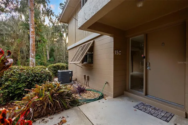a couple of potted plants in front of door
