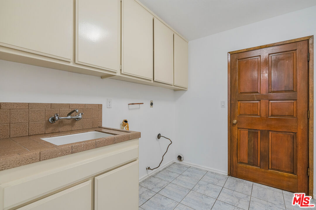 1181 Somera Road Los Angeles, CA 90077 - Photo 28 of 40 a room with storage and utility