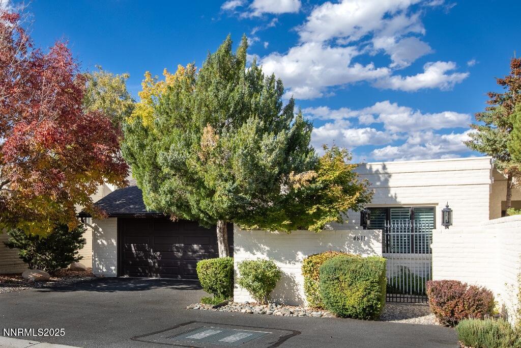4811 Lakeridge Terrace West Reno, NV 89509 - Photo 2 of 43 a front view of a house with a garden