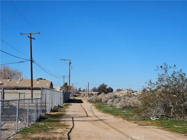 a view of a street with benches