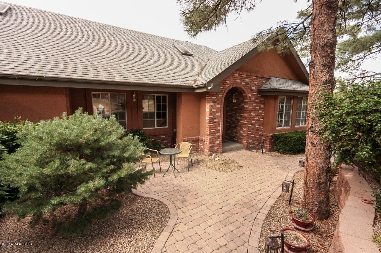 1380 East Valley View Road Prescott, AZ 86303 - Photo 11 of 36 a front view of a house with garden