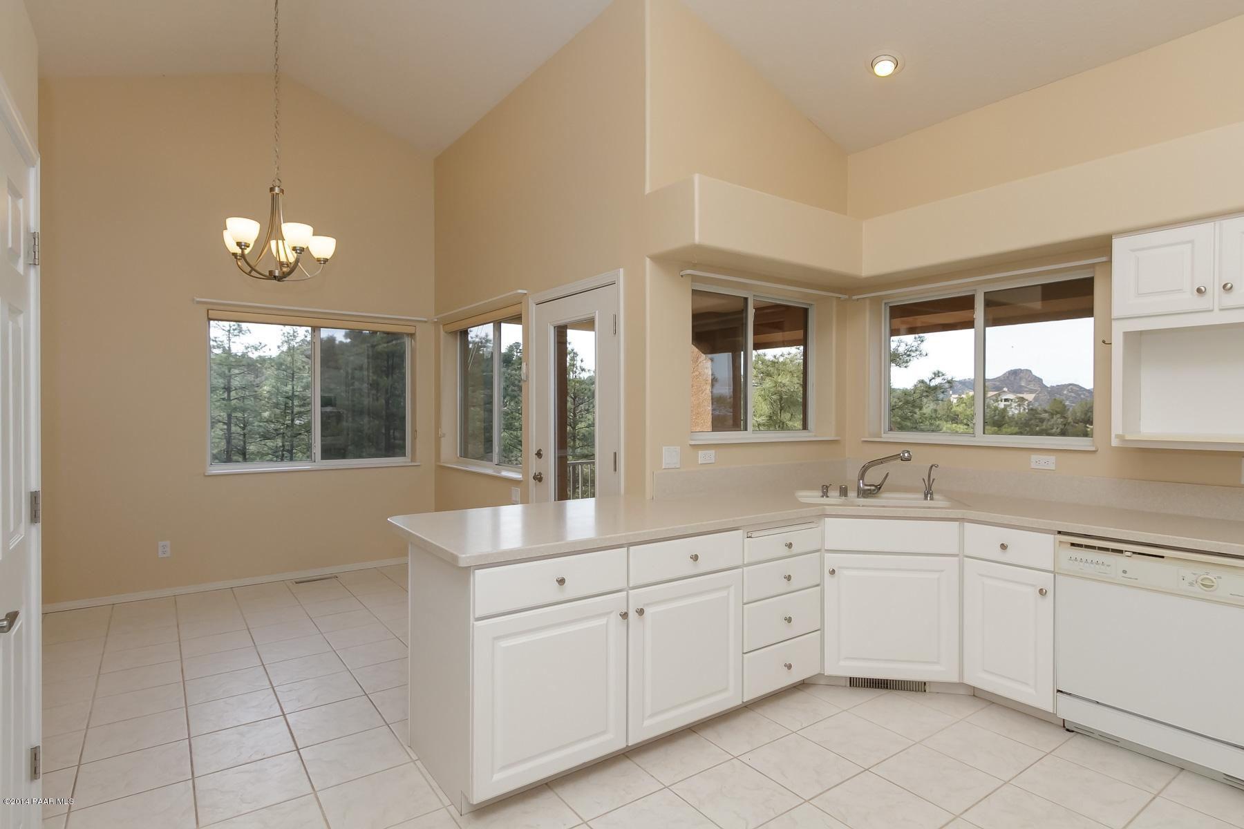 1380 East Valley View Road Prescott, AZ 86303 - Photo 18 of 36 a kitchen with a sink and cabinets
