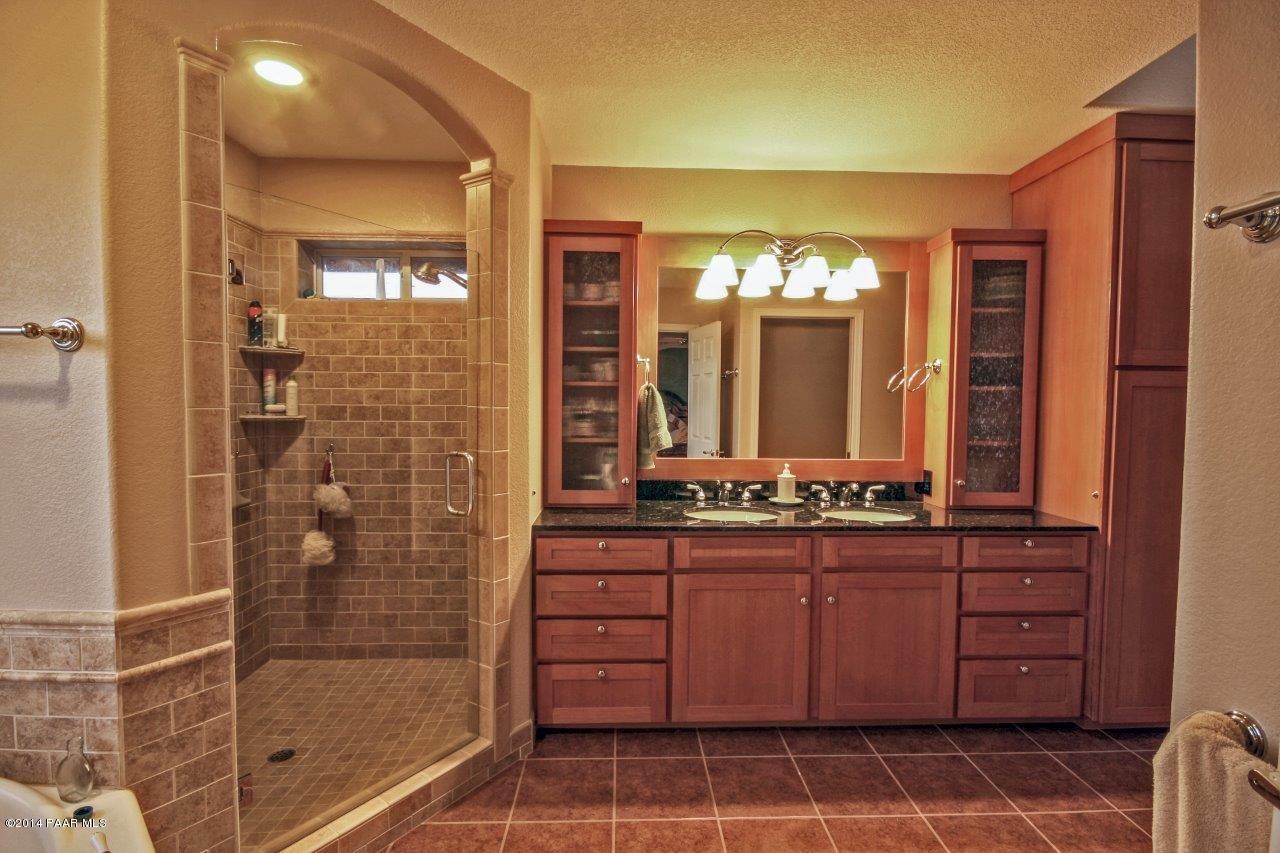 1380 East Valley View Road Prescott, AZ 86303 - Photo 21 of 36 a bathroom with a double vanity sink and a mirror