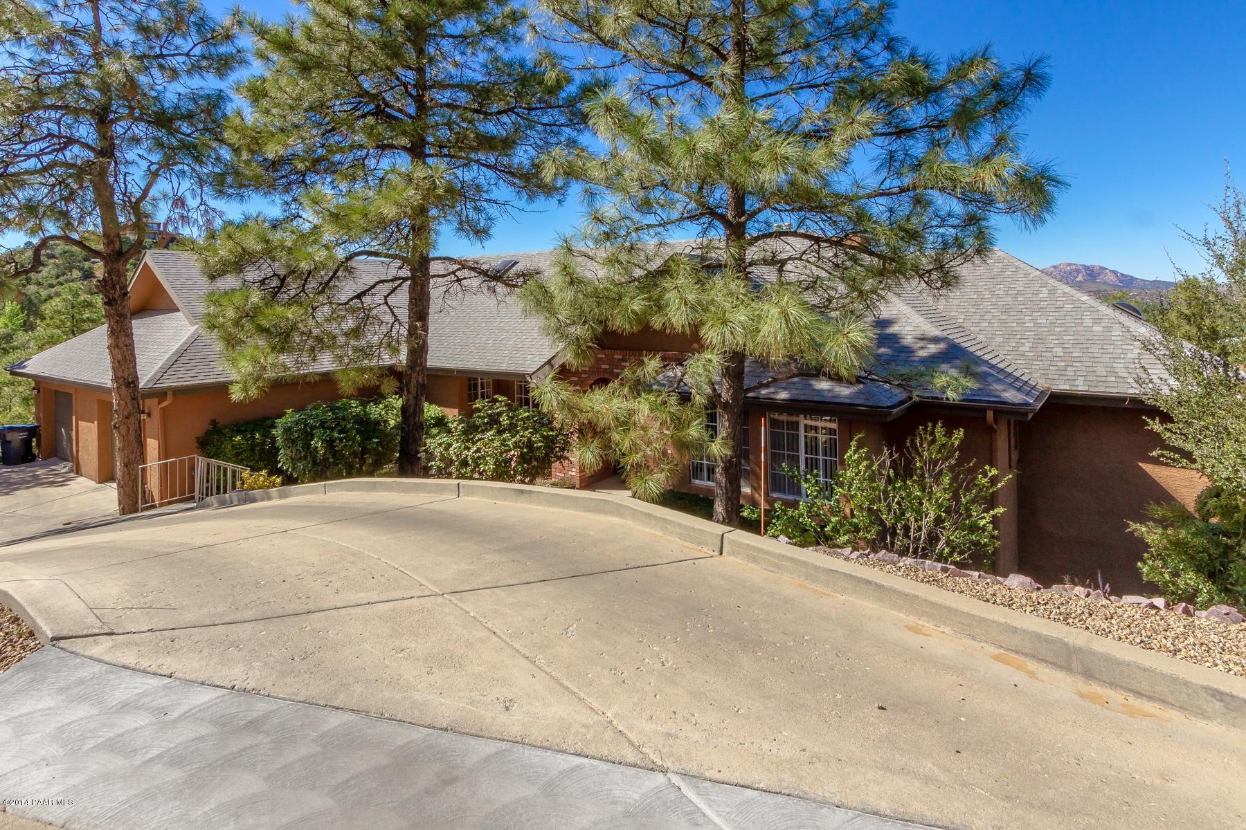 1380 East Valley View Road Prescott, AZ 86303 - Photo 3 of 36 a house with a tree in the background