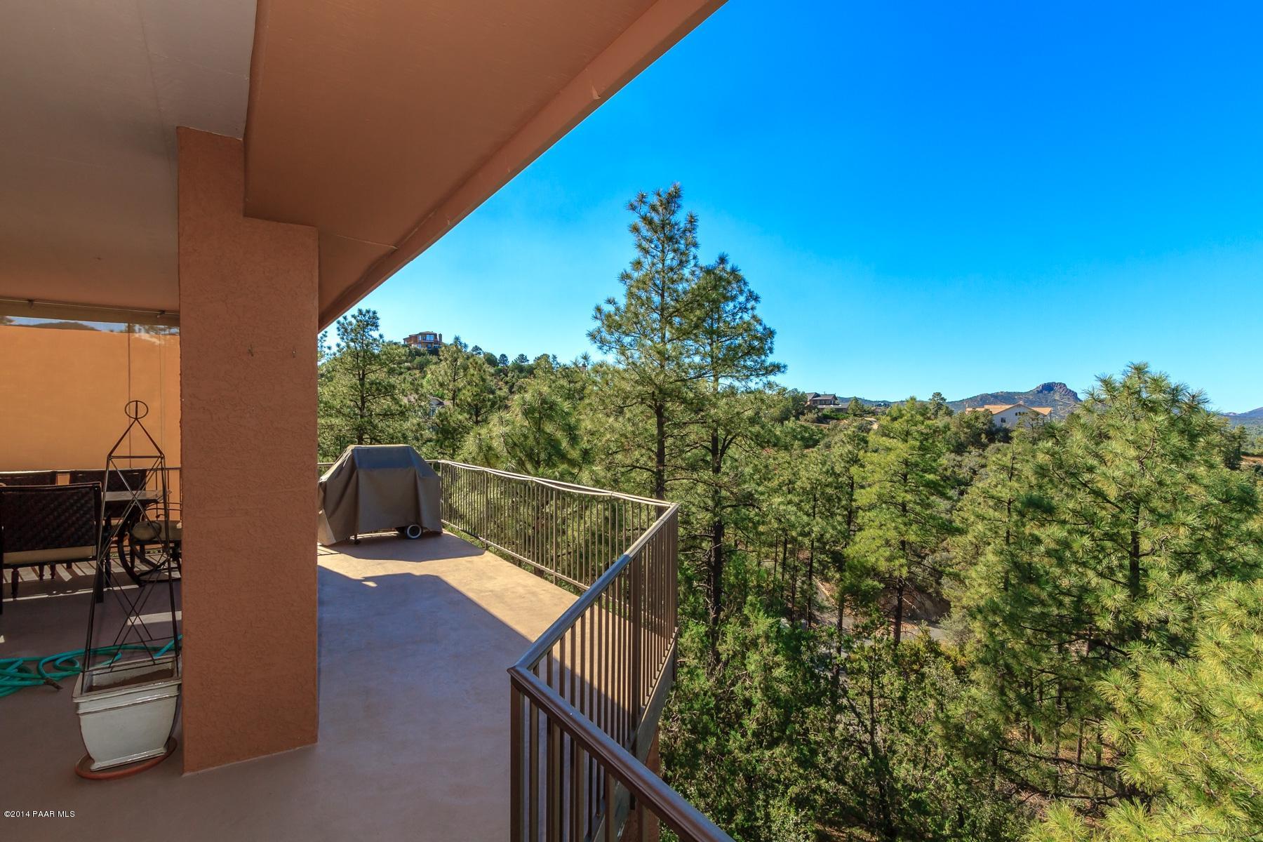 1380 East Valley View Road Prescott, AZ 86303 - Photo 35 of 36 a view of a balcony with chairs and wooden fence