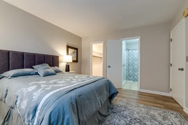 a bed room with a bed and a window