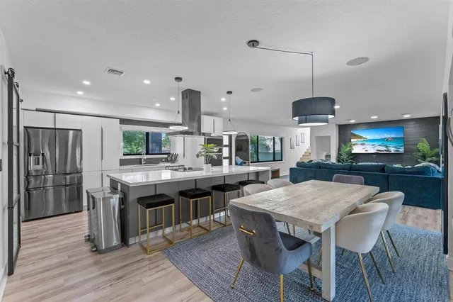 a bed room with a bed window and mirror