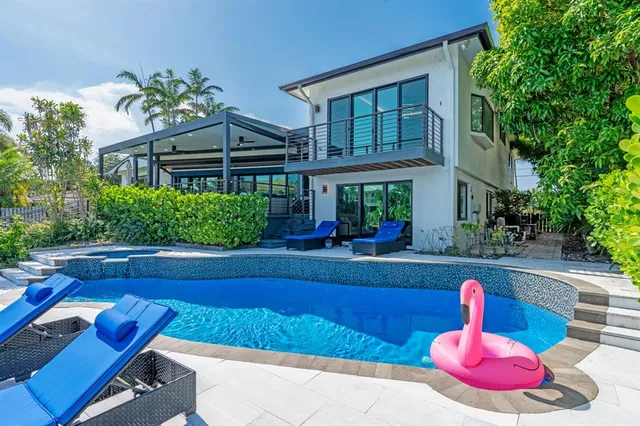 a view of swimming pool with outdoor seating
