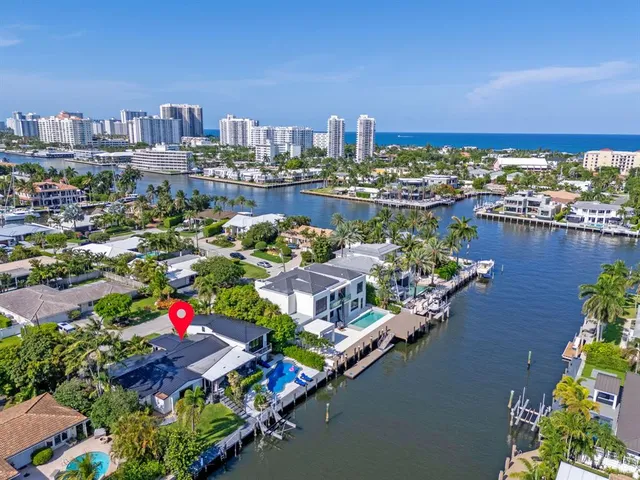 a bedroom with a large bed and a large window