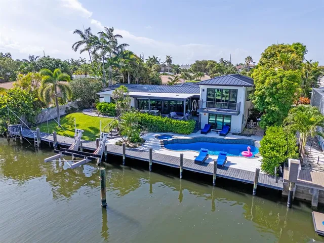 a view of swimming pool with outdoor seating