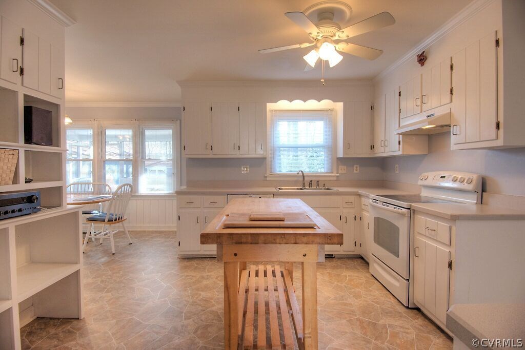 13325 Lady Ashley Road Midlothian, VA 23114 - Photo 13 of 31 a kitchen with a stove a sink and white cabinets