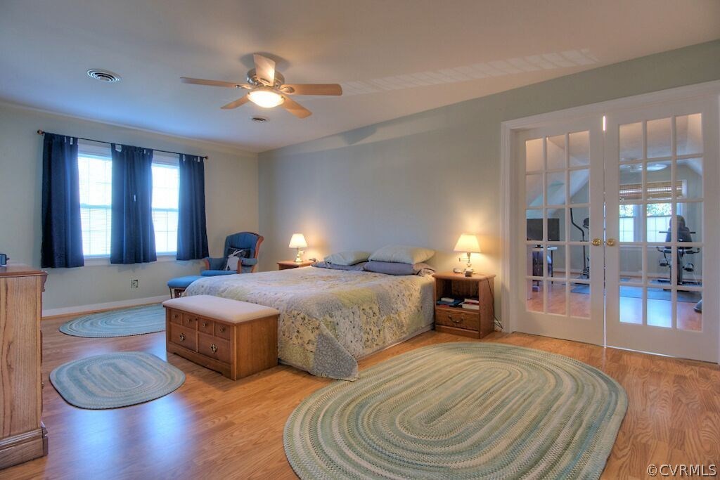 13325 Lady Ashley Road Midlothian, VA 23114 - Photo 17 of 31 a spacious bedroom with double bed and a large mirror