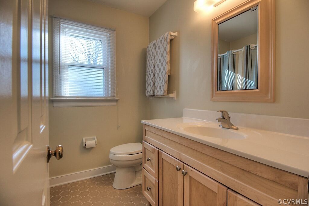 13325 Lady Ashley Road Midlothian, VA 23114 - Photo 23 of 31 a bathroom with a sink a toilet and mirror