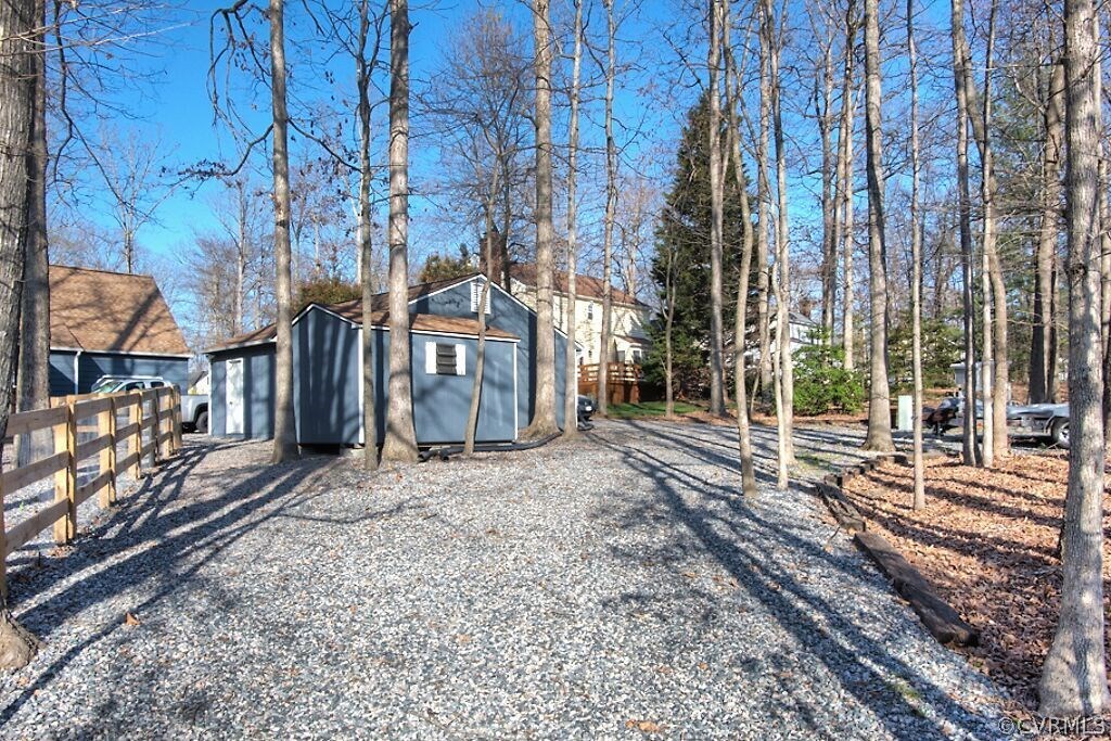 13325 Lady Ashley Road Midlothian, VA 23114 - Photo 28 of 31 a view of a backyard with large trees