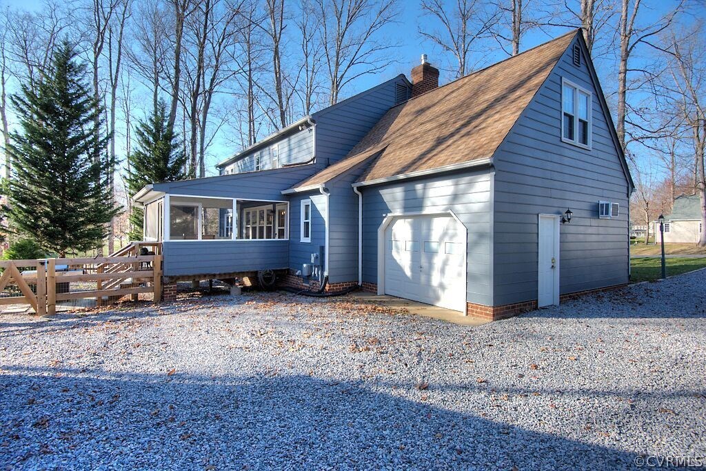 13325 Lady Ashley Road Midlothian, VA 23114 - Photo 30 of 31 a wooden house with large trees and wooden fence