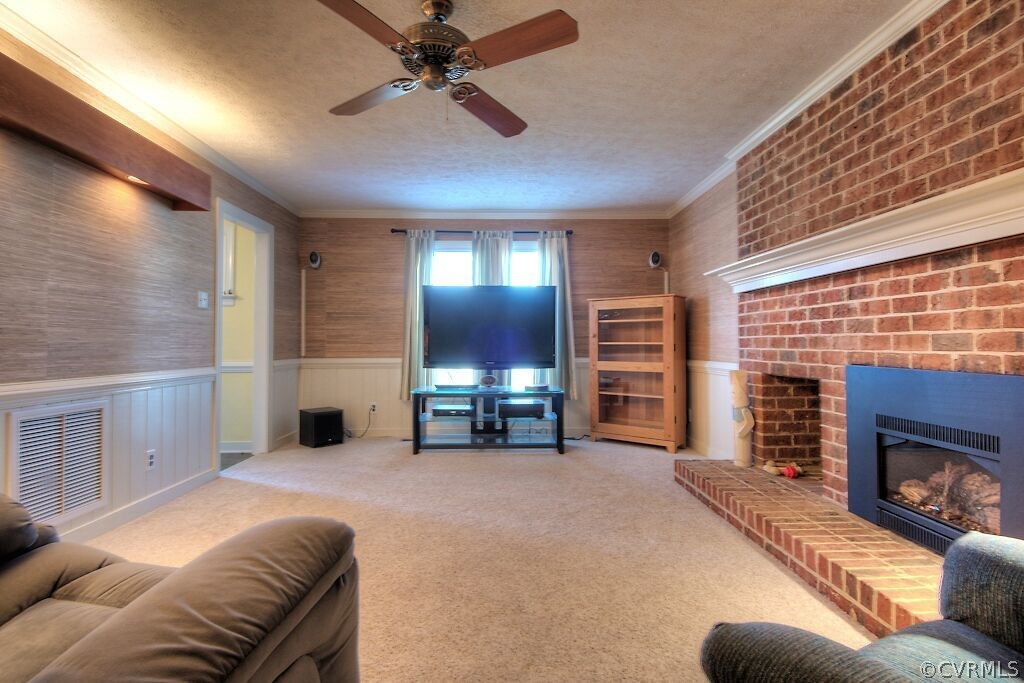 13325 Lady Ashley Road Midlothian, VA 23114 - Photo 5 of 31 a living room with furniture and a fireplace